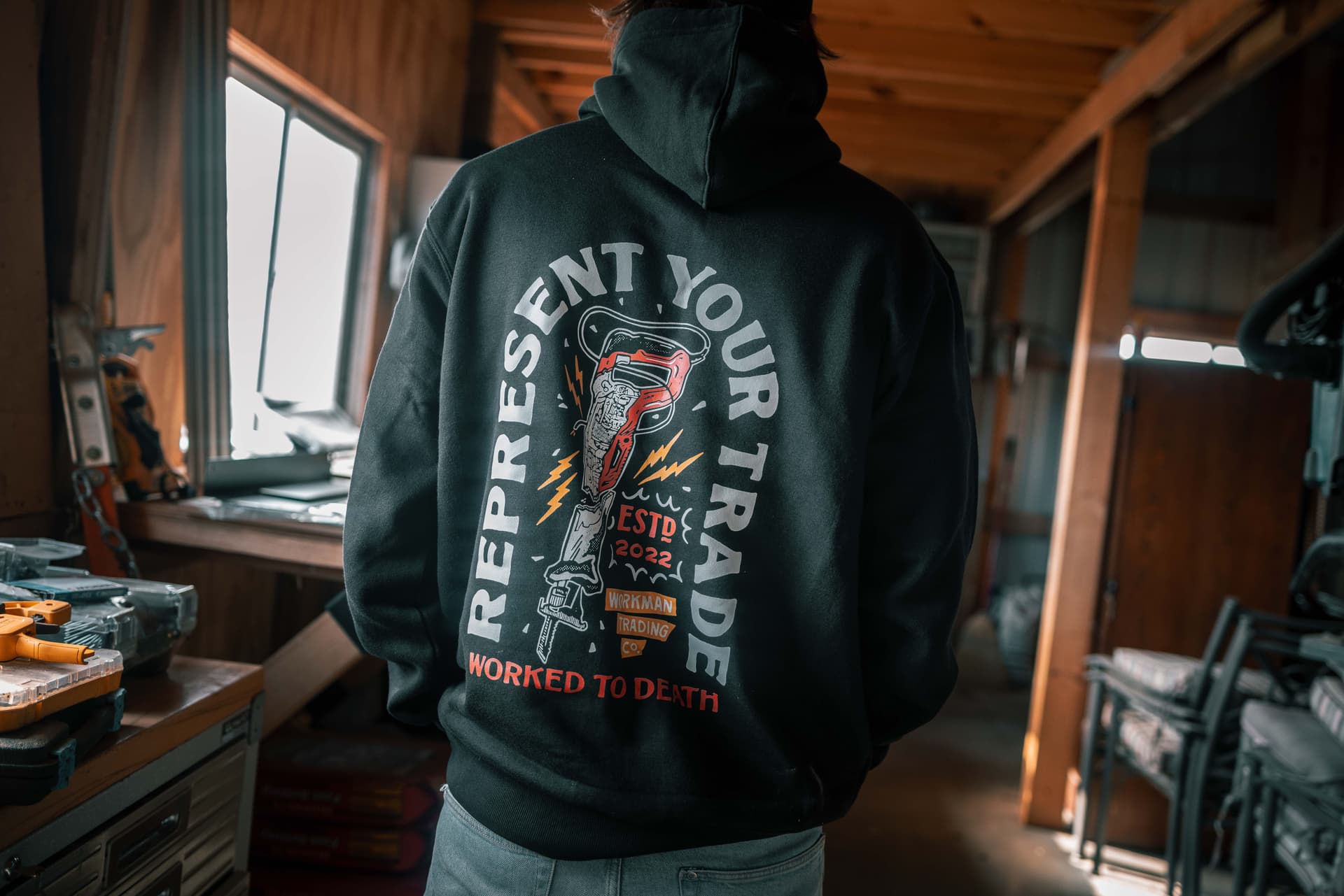 Represent your trade: a Workman hoodie in the workshop.