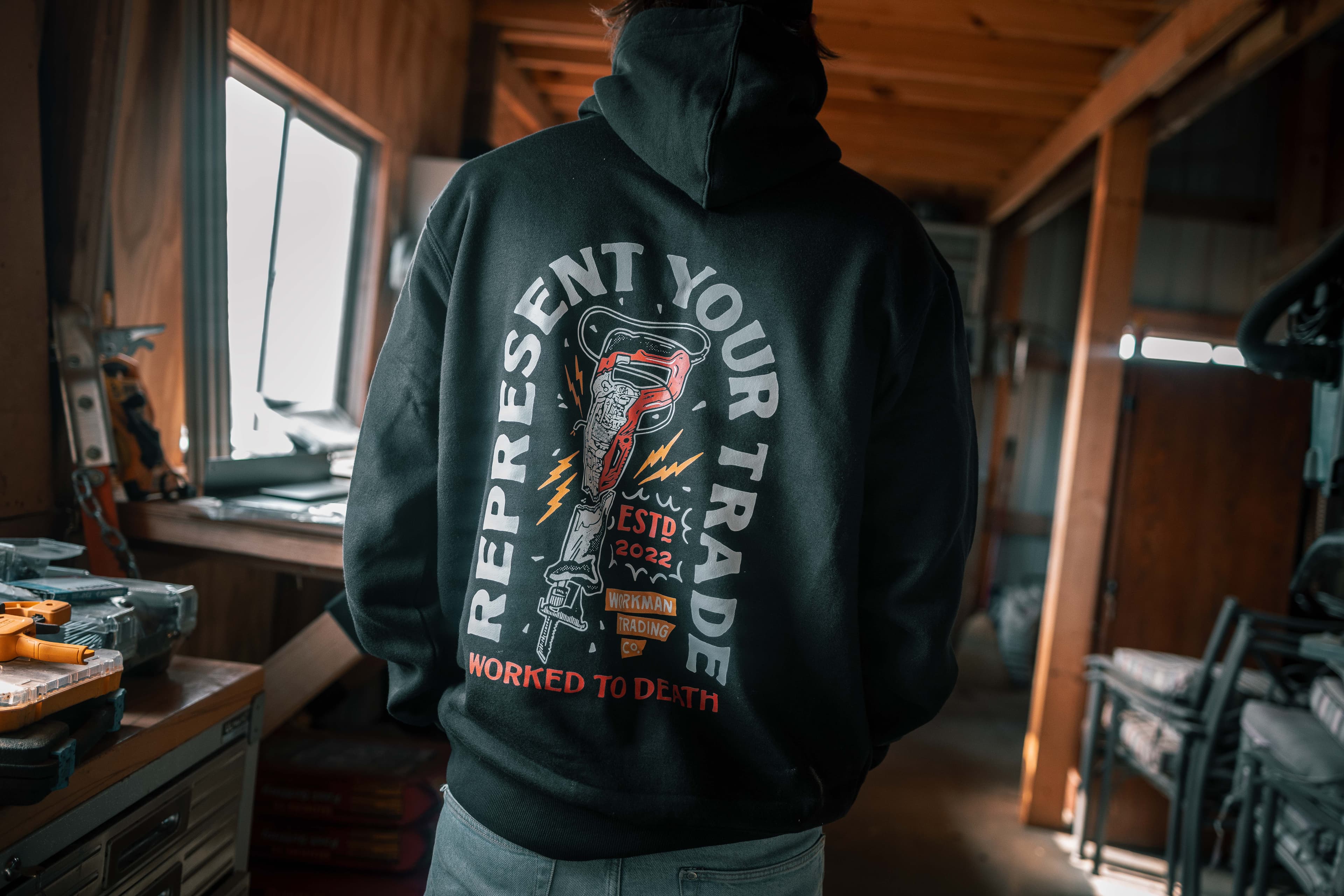 Represent your trade: a Workman hoodie in the workshop.
